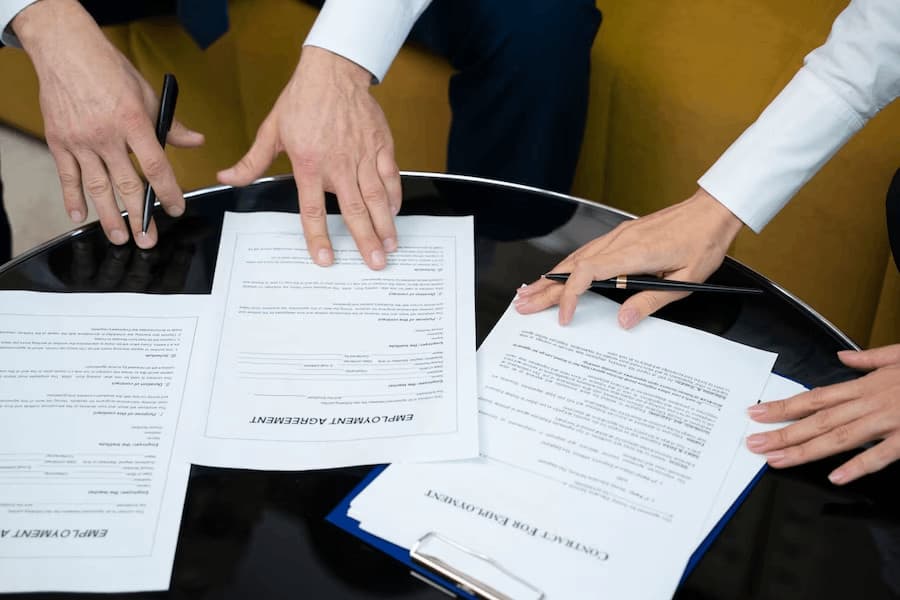 High-angle shot employment agreement signing